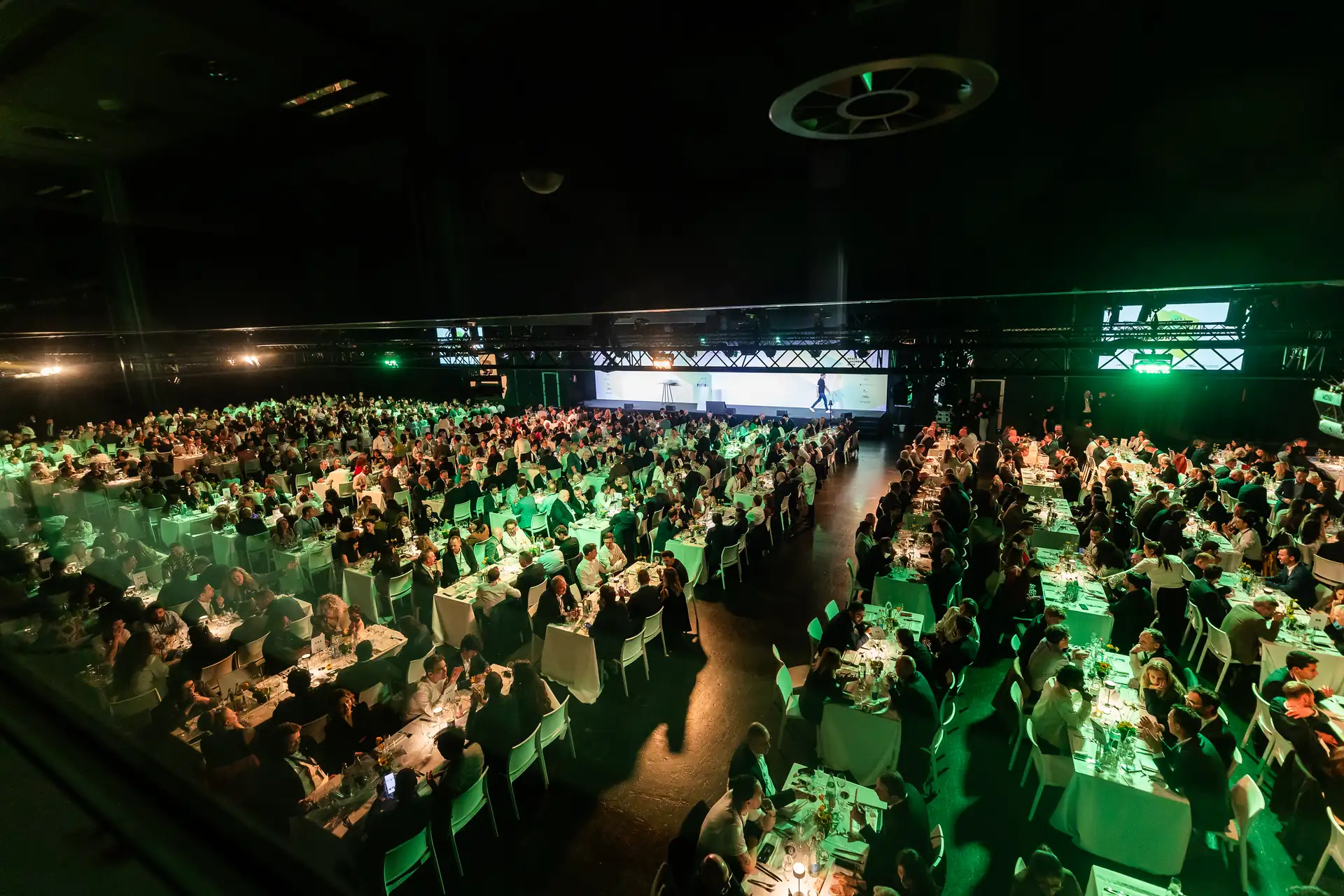 Guests seated at long tables in the Luxexpo hall during the Nexus Luxembourg closing dinner